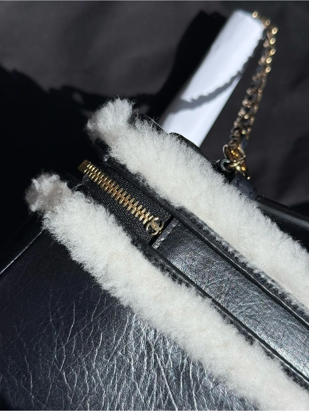 CHANEL Black Leather Shoulder Bag with White Shearling Trim